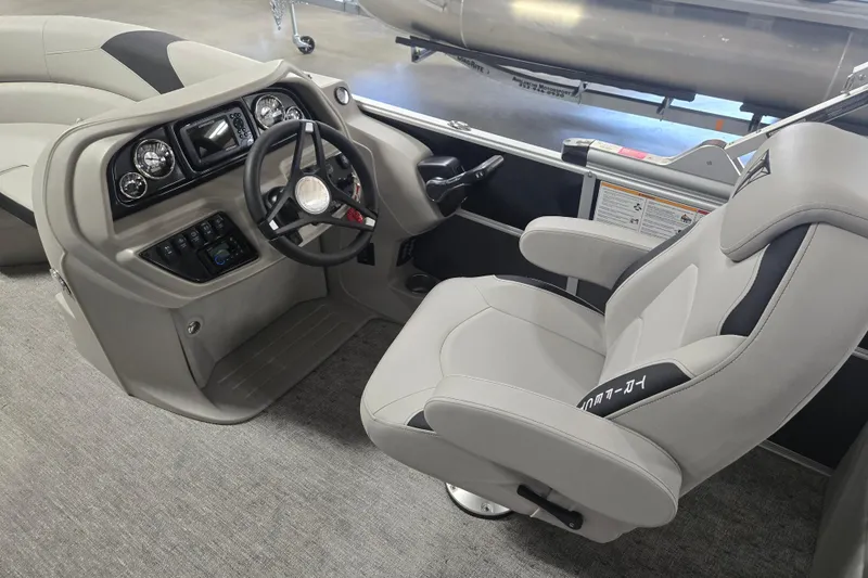 Slide: The Image of 2025 Trifecta 20RF LE boat interior with steering wheel and captain's chair. - 9