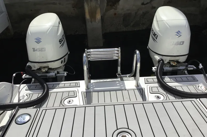 Slide: The Image of Twin Vee 240 DC GF 2020 boat with dual Suzuki 140 outboard motors. - 13
