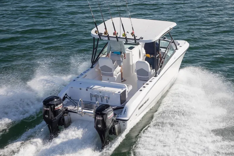 Slide: The Image of Manufacturer Provided Image: 2020 Twin Vee 240 DC GF boat cruising on water with dual outboard motors. - 25