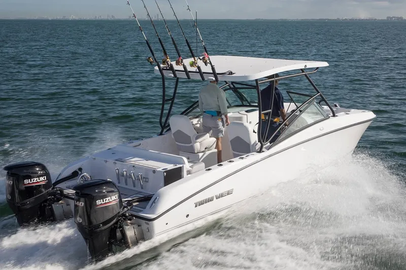 Slide: The Image of Manufacturer Provided Image: 2020 Twin Vee 240 DC GF boat cruising on the water with fishing rods. - 29