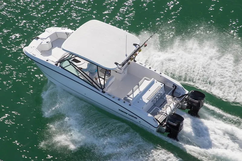 Slide: The Image of Manufacturer Provided Image: 2020 Twin Vee 240 DC GF boat cruising on water with dual outboard motors. - 31