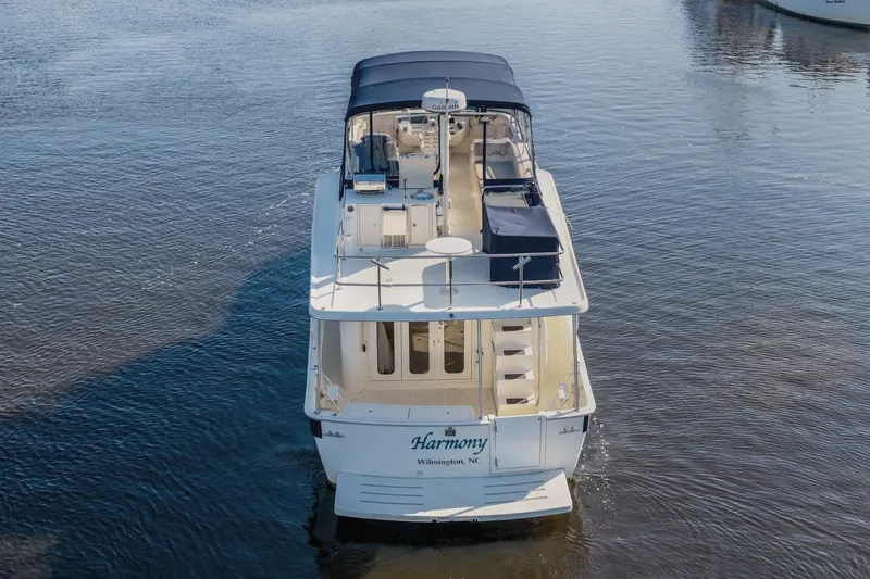 Slide: The Image of 2009 Mainship 40 Expedition yacht on calm water, rear view, Wilmington, NC. - 9