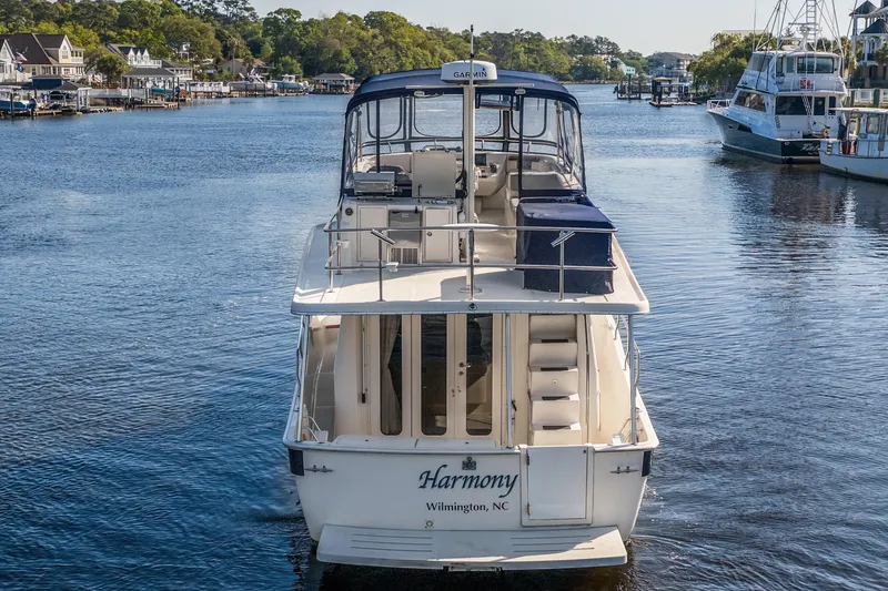 Slide: The Image of 2009 Mainship 40 Expedition boat named "Harmony" docked in Wilmington, NC. - 11