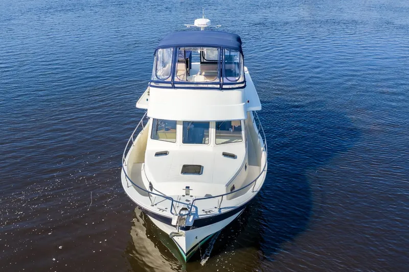 Slide: The Image of 2009 Mainship 40 Expedition boat on calm water, aerial view. - 6