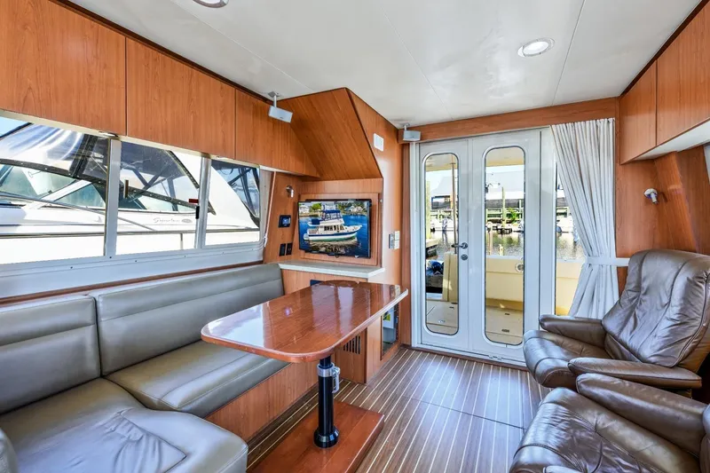 Slide: The Image of Interior of 2009 Mainship 40 Expedition yacht with leather seating and wooden accents. - 23