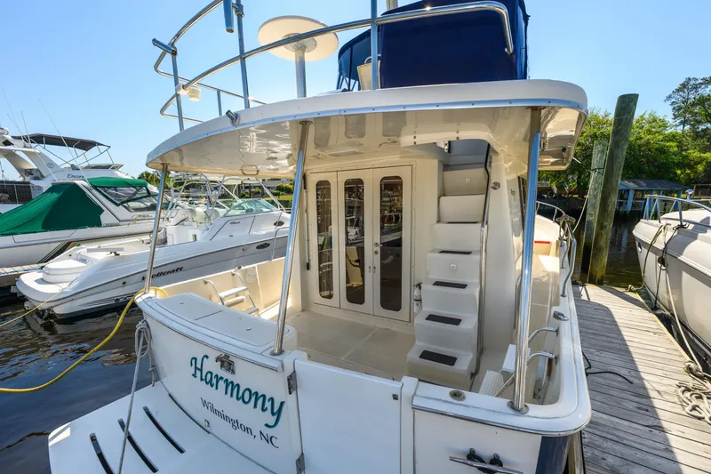 Slide: The Image of 2009 Mainship 40 Expedition yacht docked, featuring rear deck and stairs, Wilmington, NC. - 14