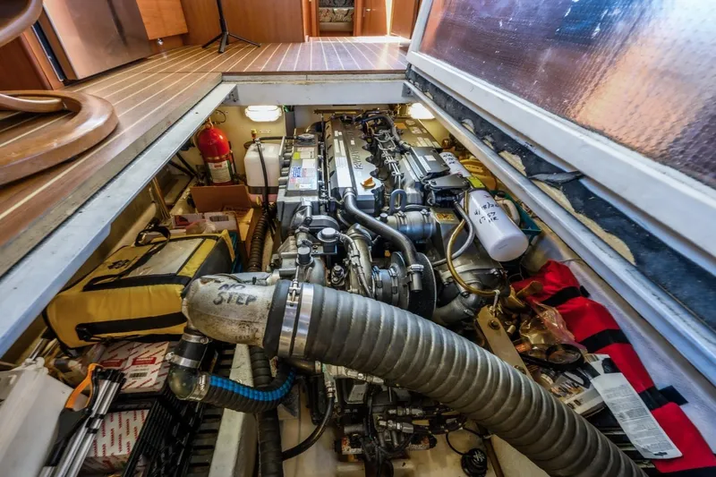 Slide: The Image of Engine room of 2009 Mainship 40 Expedition yacht, showcasing detailed mechanical components. - 28