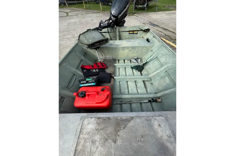Slide: The Image of 1992 Weldcraft 1648 boat interior with motor, fuel tank, and accessories. - 6