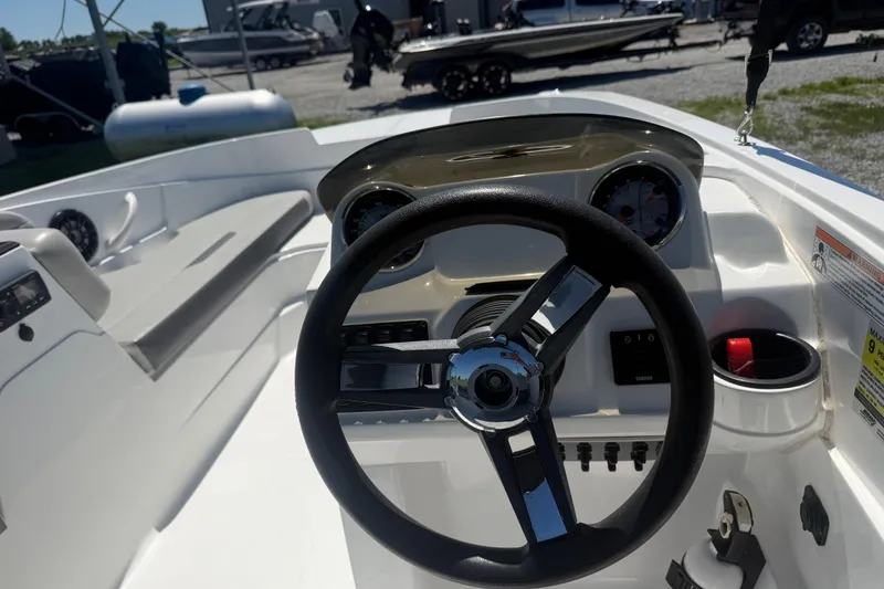 Slide: The Image of 2020 Hurricane SunDeck Sport 185 OB boat dashboard with steering wheel and gauges. - 10