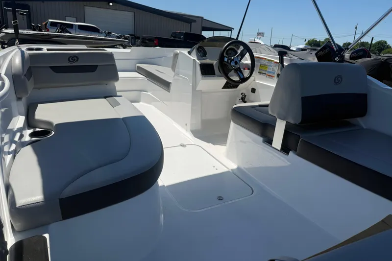Slide: The Image of 2020 Hurricane SunDeck Sport 185 OB interior with sleek seating and modern dashboard design. - 8