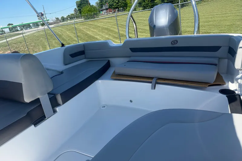 Slide: The Image of 2020 Hurricane SunDeck Sport 185 OB interior with gray seating and open deck space. - 9