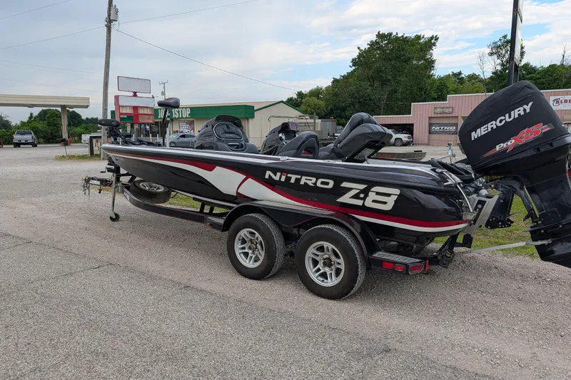 Slide: The Image of 2011 Nitro Z-8 boat with Mercury Pro XS engine on trailer in parking lot. - 39
