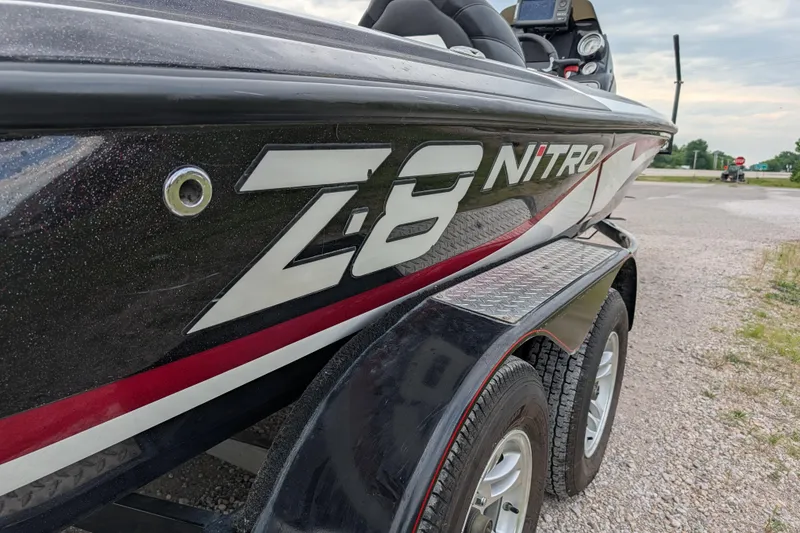Slide: The Image of 2011 Nitro Z-8 boat on trailer, showcasing sleek design and branding. - 42