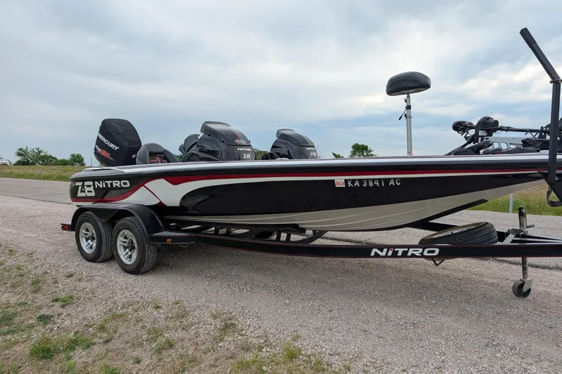 Slide: The Image of 2011 Nitro Z-8 boat on trailer, featuring dual engines and sleek design. - 45