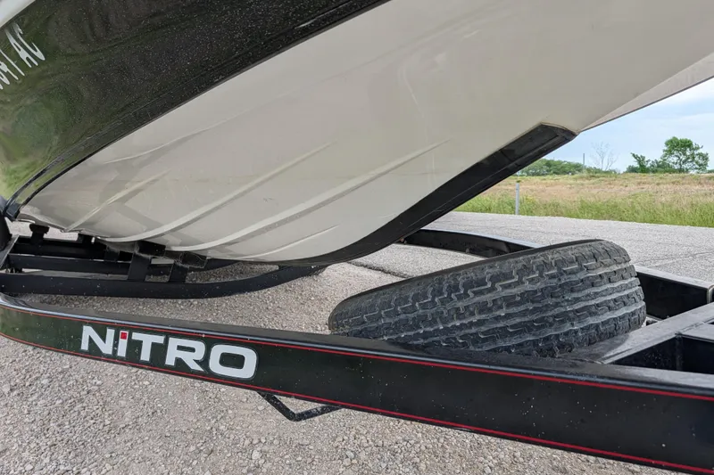 Slide: The Image of 2011 Nitro Z-8 boat on trailer, close-up view of hull and tire. - 47