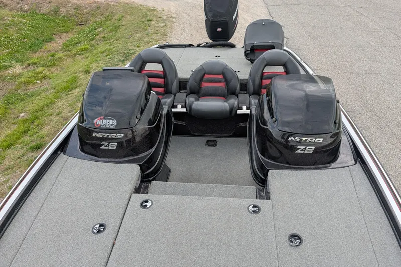 Slide: The Image of 2011 Nitro Z-8 boat interior with dual engines and seating. - 51