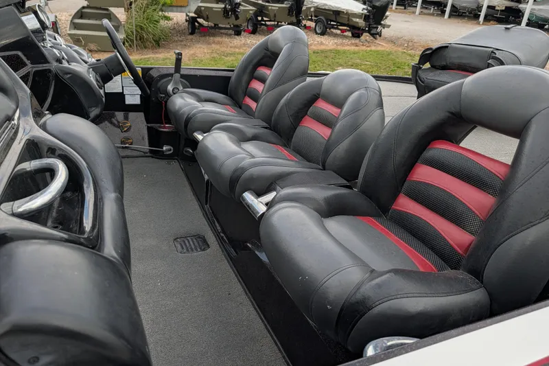Slide: The Image of Interior of a 2011 Nitro Z-8 boat with black and red seating. - 53