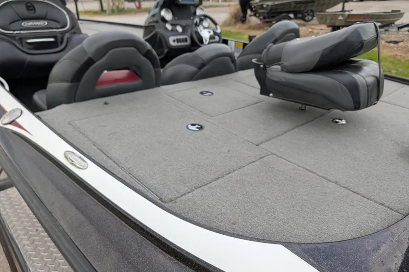 Slide: The Image of 2011 Nitro Z-8 boat interior with gray carpet and seating. - 54