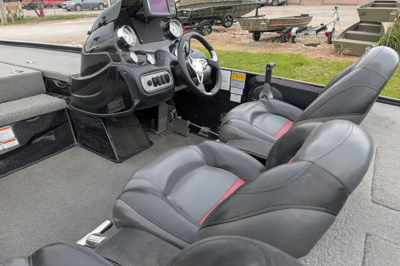 Slide: The Image of Interior of a 2011 Nitro Z-8 boat with dual seats and control panel. - 55