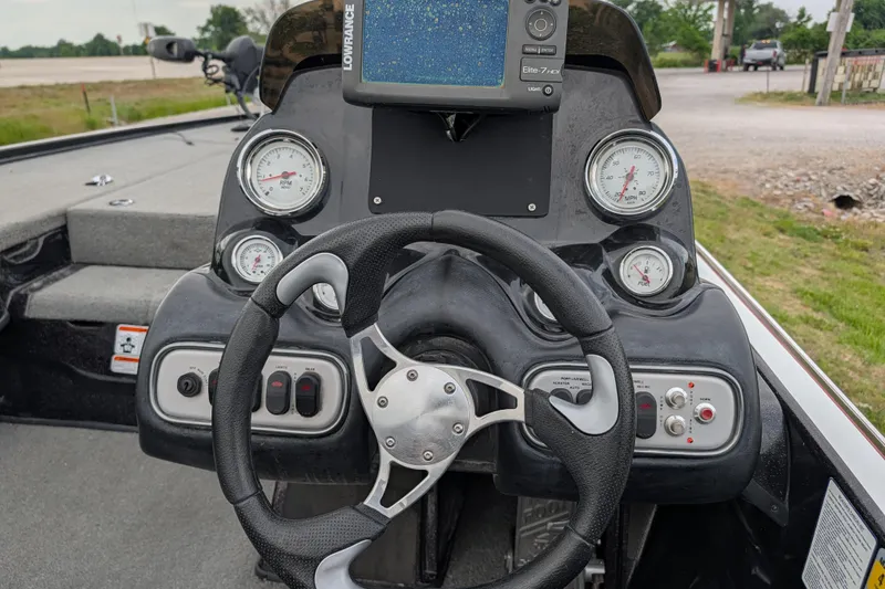 Slide: The Image of Steering console of a 2011 Nitro Z-8 boat with gauges and navigation system. - 56