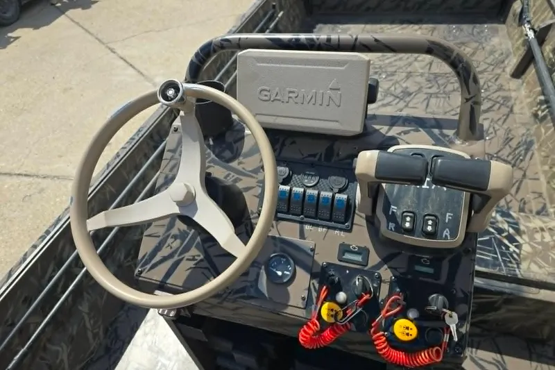 Slide: The Image of 2021 Prodrive 2060 boat dashboard with Garmin navigation, steering wheel, and control panel. - 10