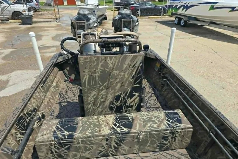 Slide: The Image of Camouflage-patterned 2021 Prodrive 2060 boat interior with steering console and seating. - 11