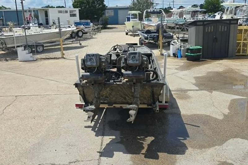 Slide: The Image of Boat with dual Prodrive 2060 motors in a marina, surrounded by other boats. - 6