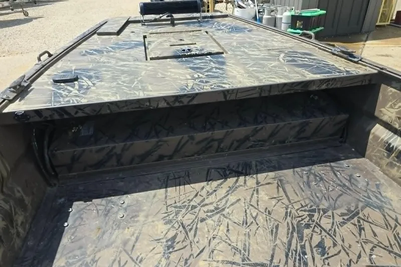 Slide: The Image of 2021 Prodrive 2060 boat interior with camouflage pattern, showcasing storage compartments. - 8