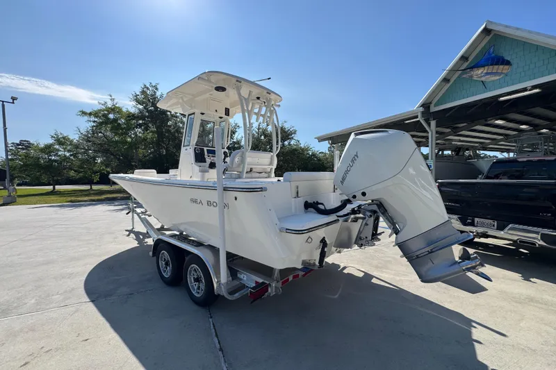 Slide: The Image of 2027 Sea Born LX22 Center Console boat on trailer with Mercury outboard motor. - 14