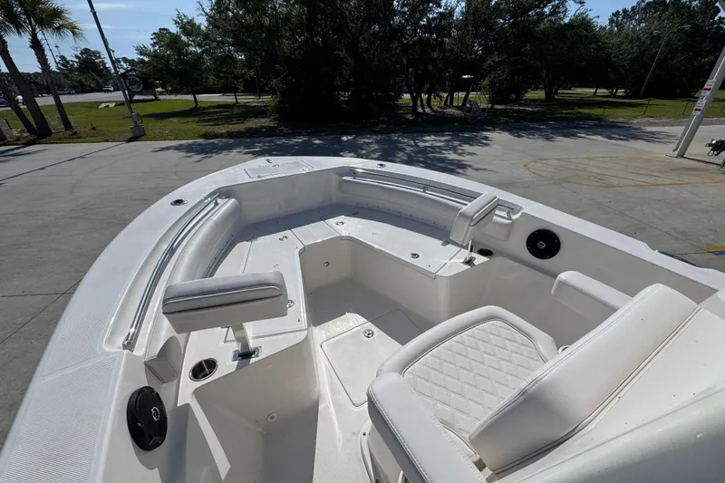 Slide: The Image of 2027 Sea Born LX22 Center Console boat with white seating and spacious deck. - 18