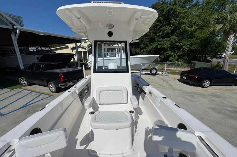 Slide: The Image of 2027 Sea Born LX22 Center Console boat in a marina setting, showcasing sleek design. - 21