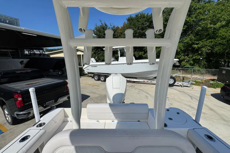 Slide: The Image of 2027 Sea Born LX22 Center Console boat on trailer, viewed from rear deck. - 26