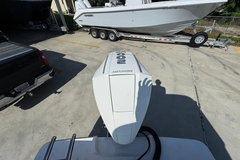 Slide: The Image of 2027 Sea Born LX22 Center Console with Mercury engine in a parking lot. - 36