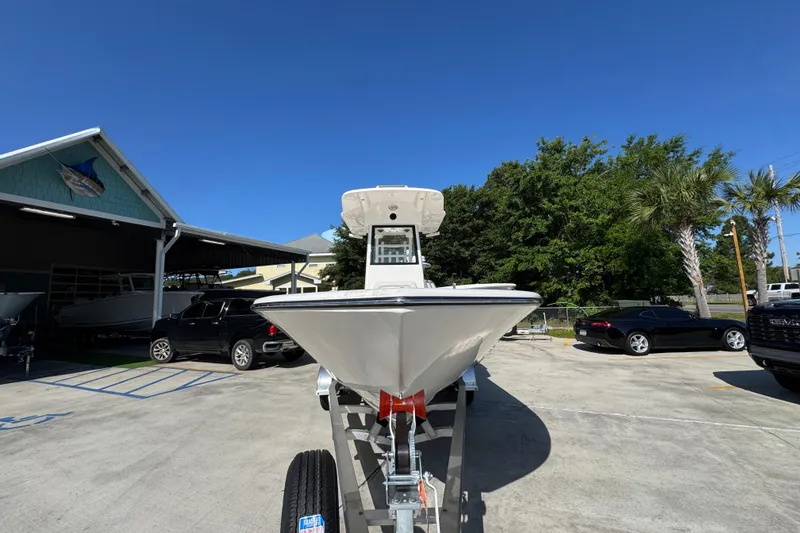 Slide: The Image of 2027 Sea Born LX22 Center Console boat on trailer in sunny parking lot. - 5