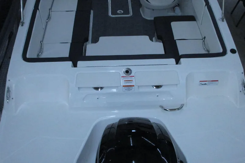 Slide: The Image of 2020 Bayliner VR4 Bowrider OB interior with seating and engine view. - 10