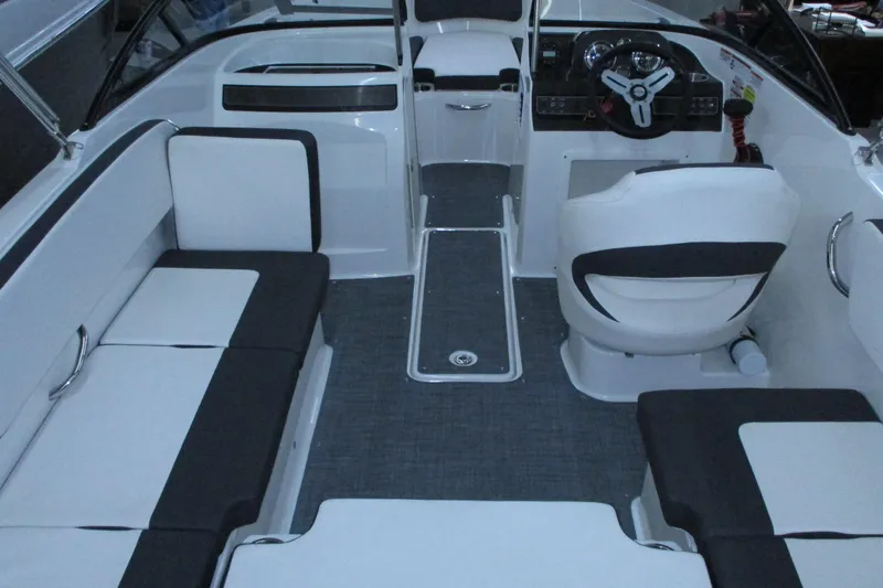 Slide: The Image of 2020 Bayliner VR4 Bowrider OB interior with seating and steering wheel. - 11