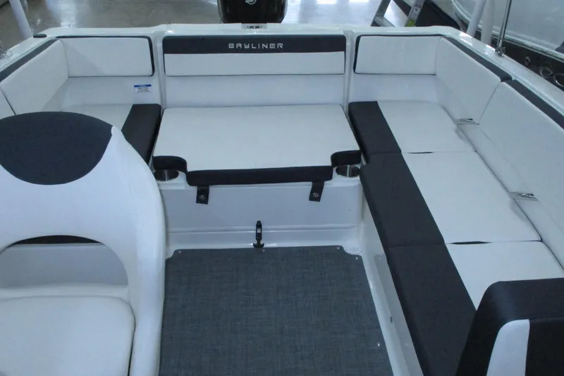 Slide: The Image of 2020 Bayliner VR4 Bowrider OB interior with white and black seating arrangement. - 15