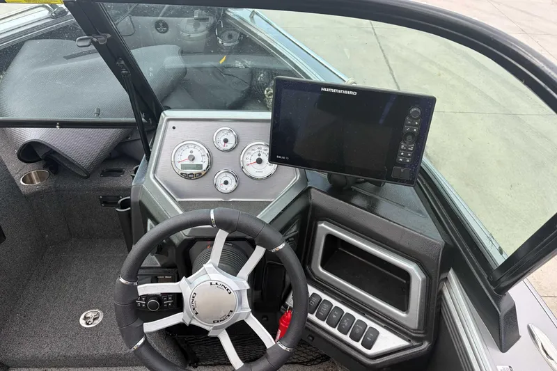 Slide: The Image of Cockpit of 2023 Lund 1975 Tyee boat with steering wheel and navigation system. - 3
