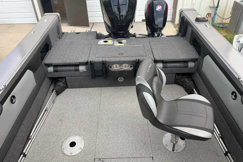Slide: The Image of 2023 Lund 1975 Tyee boat interior with seating and storage compartments. - 5