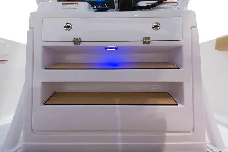 Slide: The Image of Manufacturer Provided Image: 2021 Sportsman Open 232 Center Console storage compartments with blue LED lighting. - 14