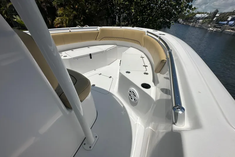 Slide: The Image of 2021 Sportsman Open 232 Center Console boat interior with seating and speaker. - 28