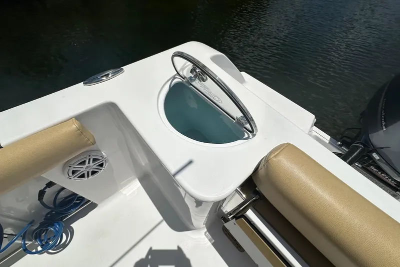 Slide: The Image of 2021 Sportsman Open 232 Center Console boat interior with seating and steering wheel. - 30