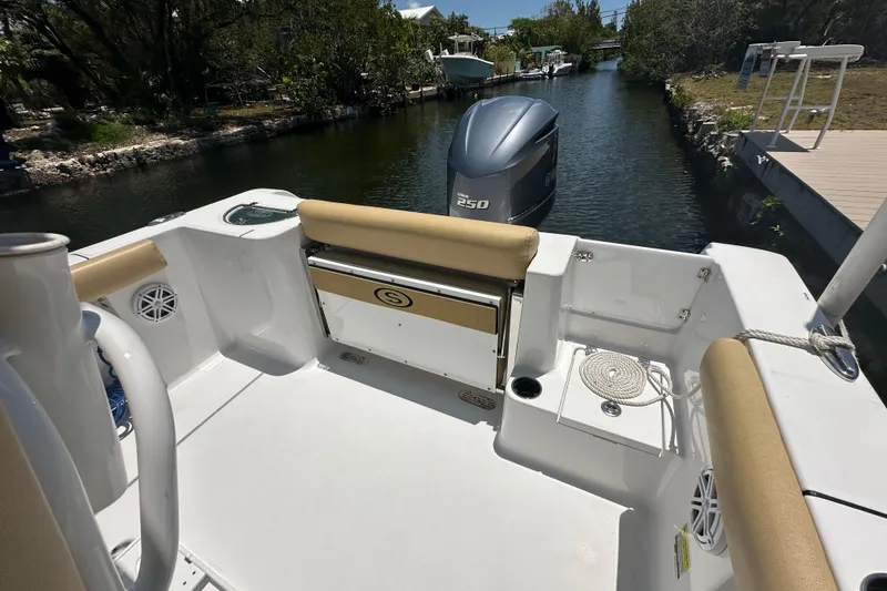 Slide: The Image of 2021 Sportsman Open 232 Center Console boat with Yamaha 250 engine in a scenic canal. - 31