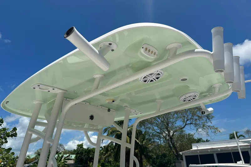 Slide: The Image of 2021 Sportsman Open 232 Center Console boat top view with rod holders and speakers. - 36