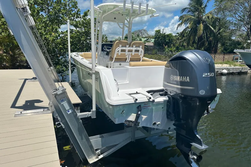 Slide: The Image of 2021 Sportsman Open 232 Center Console boat with Yamaha 250 engine on a lift. - 37