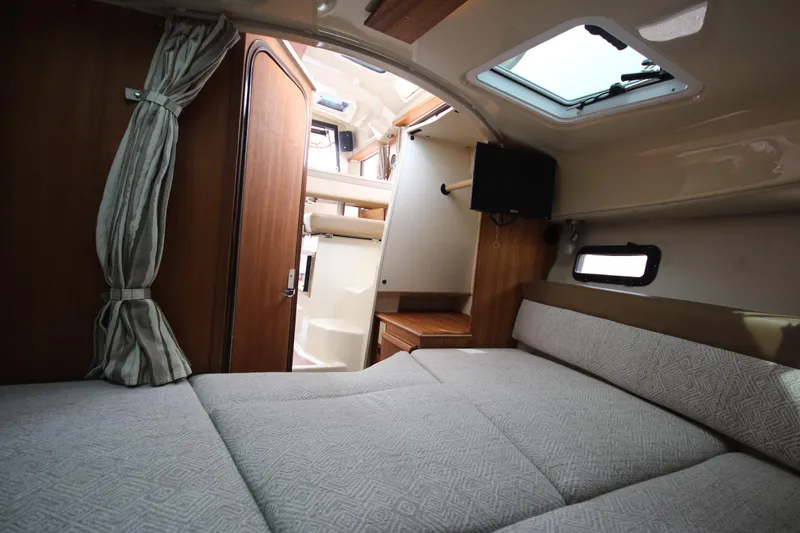 Slide: The Image of Interior of 2025 Ranger Tugs R-25 boat, featuring cozy cabin and modern amenities. - 37