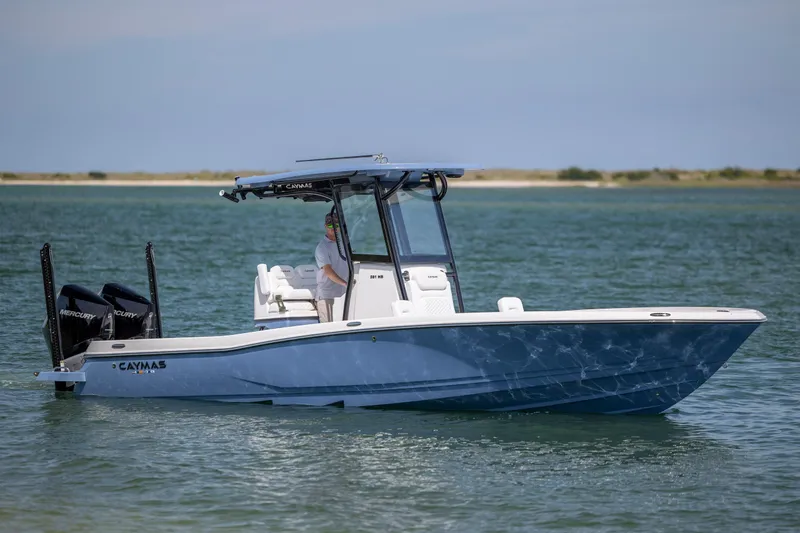 The Image of 2026 Caymas 281 HB boat on water, featuring dual Mercury engines and sleek design. - 0