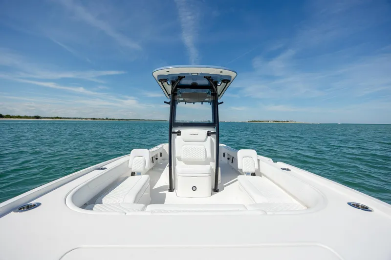Slide: The Image of 2026 Caymas 281 HB boat on open water under clear blue sky. - 17