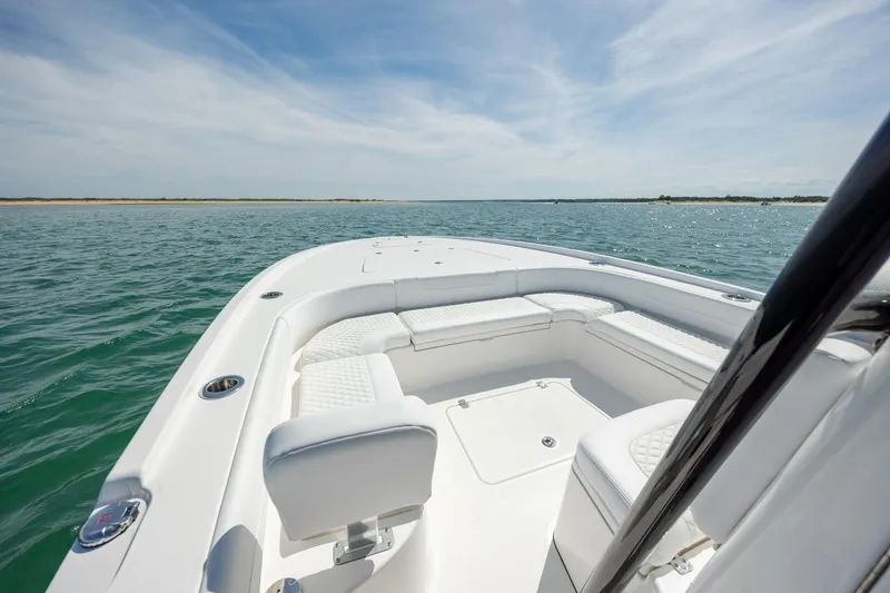 Slide: The Image of 2026 Caymas 281 HB boat on open water, featuring spacious seating and sleek design. - 18