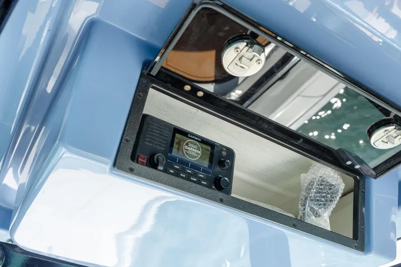 Slide: The Image of 2026 Caymas 281 HB boat with Garmin marine radio in storage compartment. - 21